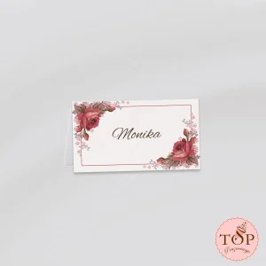 Personalizirana kartica za sedežni red z motivom vrtnice v vintage slogu, primerna za poročno namizno dekoracijo.